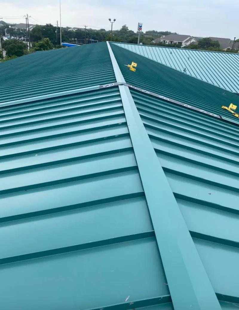 Green commercial metal roof ridge and valley for Metal Roof Repair in Swartz Creek